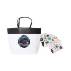 White tote bag with Thank you design and multiple sheets of colorful stickers.
