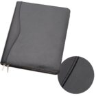 A black leather portfolio folder with a zipper closure is shown. There is a close-up inset highlighting the stitched seam detail on the cover.