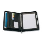Open black leather binder with lined paper, pen holder with pen, zipper pocket, and slots for business cards and documents.