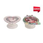 Two custom pop sockets: a heart with a cat and a Christmas-themed design.