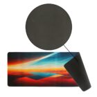 Rectangular desk mat with a sunset sky design and a non-slip black backing.