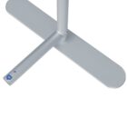 Close-up of a gray metal stand base with a small blue square and dot marking.