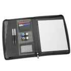 An open black organizer with a lined notepad on the right. The left side has slots for cards, two pens, and two USB drives. The interior features a black and white striped fabric design.