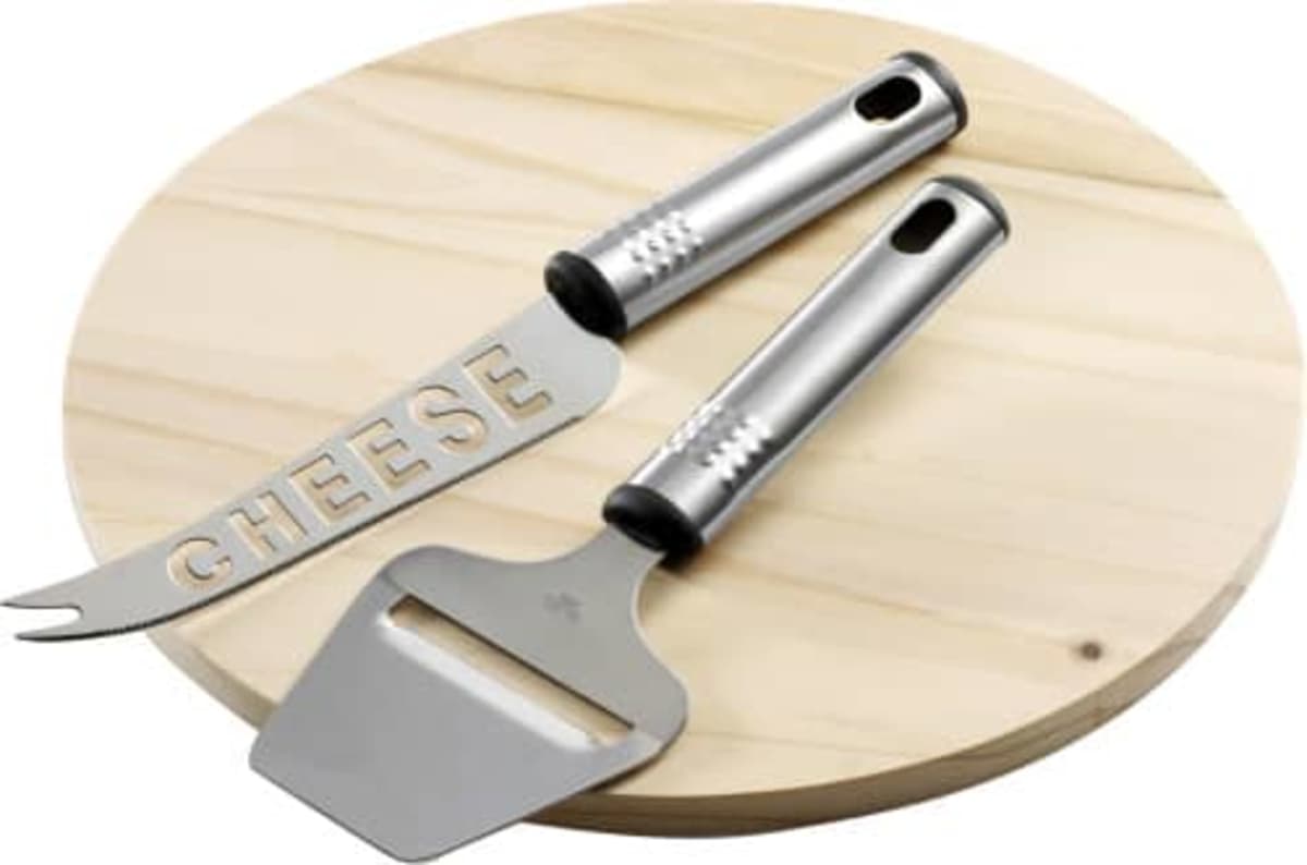 Cheese knife and slicer on a round wooden board.