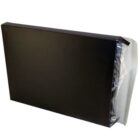 A black, rectangular box standing upright, partially wrapped in clear plastic. The right side of the box is exposed, while the left side has a semi-transparent flap covering it. The background is plain white.