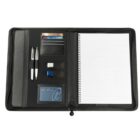 Open black leather portfolio with a lined notebook on the right side. The left side has slots for business cards, pens, a USB drive, and a pocket. A zipper surrounds the portfolio.
