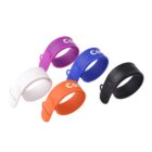 Four colorful, curved slap bracelets in white, purple, blue, and orange on a white background.