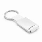 Silver and white fabric keychain with a rectangular metal plate on a white background.