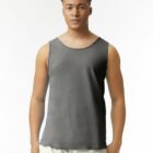 Man wearing a gray sleeveless tank top and light pants, standing against a white background.