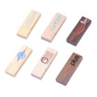 Six wooden USB drives with various logos and colors.