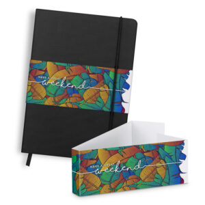 A branded corporate diary with a sleek black cover pairs perfectly with a colorful envelope adorned with Have a great weekend text and elegant leaf patterns.