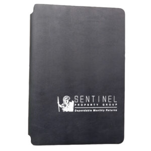 Black notebook branded with company logo