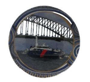 Branded badge with an image of a bridge. 