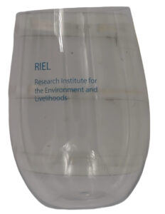 Clear glass branded with RIEL text and logo, standing upright