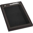 A black notebook with an elastic band is nestled in a foam-lined black box. A silver pen with a black grip is placed at the top of the box.