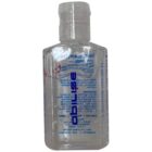 Clear bottle of hand sanitizer with blue and red text, shown with text mirrored backward.