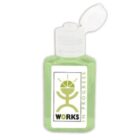 Small bottle of green hand sanitizer labeled Works in Progress with flip-top lid open.