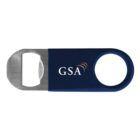 A metal bottle opener with a blue handle. The handle has a circular hole at one end and displays the letters GSA with a stylized orange wave above the S.
