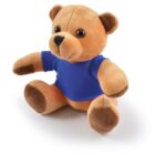 A brown plush teddy bear wearing a blue shirt, sitting on a white background.