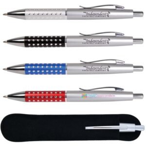 Four metallic ballpoint pens, each with a colored grip section in silver, black, blue, and red. Sporting a dotted texture, these promotional pens showcase Independent Theatre Company and Dolly Beauty Products. Ideal as corporate gifts, they are displayed with a sleek black case.