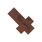 Wooden puzzle piece with the text TEN HANDS engraved on it.