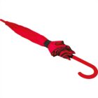 Closed red umbrella with a curved handle.