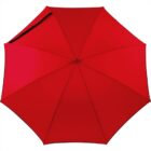 Red umbrella viewed from above, showing its structured segments and black handle.