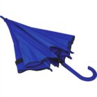 A closed blue umbrella with a curved handle on a white background.