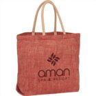 Red herringbone tote bag with Aman Spa & Resort logo in black.