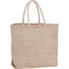 Tan woven tote bag with herringbone pattern and white handles.