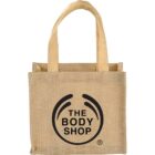 Beige tote bag with The Body Shop logo in black on the front.