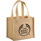 Beige jute bag with The Body Shop logo in black on the front.