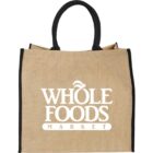 Beige Whole Foods Market tote bag with black handles and edges.