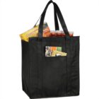 Black reusable shopping bag with groceries, including Lunchables and jars.