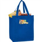 Blue reusable grocery bag with food items, including snacks and bottled drinks.