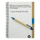 Open notebook with handwritten notes and a pen resting on it.