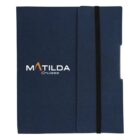 A dark blue folder with the text MATILDA Cruises in white and orange on the cover. The folder has a black elastic band strap on the right side.