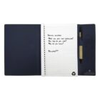 Open notebook with interview questions next to a pen, on a navy blue folder.