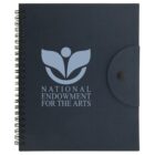 A black spiral-bound notebook with a flap and button closure. The cover features a light blue emblem and the words National Endowment for the Arts below it.