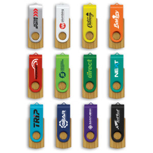 Twelve colorful promotional USB drives with unique company logos are arranged in a grid. Featuring industries like plumbing, gear, and bakery, each drive offers branding benefits with its unique design and wooden elements at the bottom.