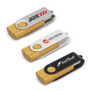 Three promotional USB drives boast bamboo bodies and metal clips. Each clip features unique designs and logos: the first is silver with Active Sports, the second has a red plumbing logo, and the third is black with Best Paint, making them stylish and practical benefits for any business.