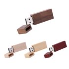 Wooden USB flash drives in different shades with their caps removed.