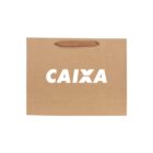 Brown paper bag with CAIXA printed in white letters on the side.