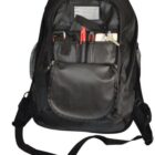 Open black backpack with visible contents: pens, organizer, and small items in front pocket.
