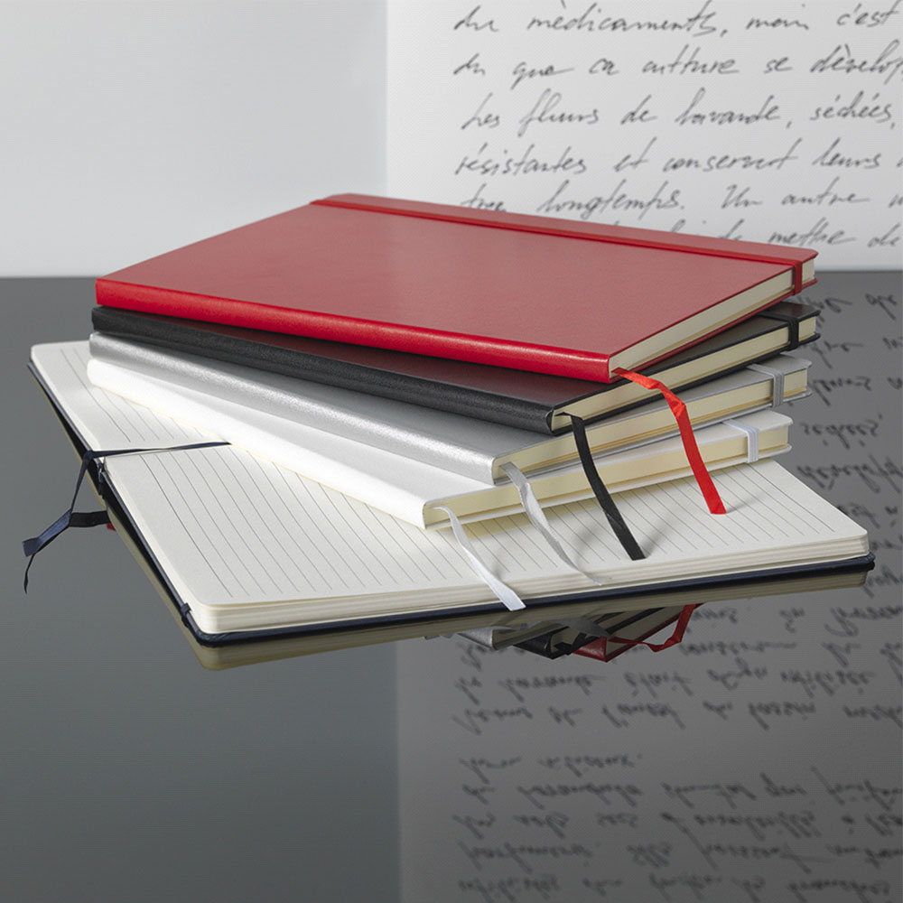 Stack of promotional notebooks in red, black and