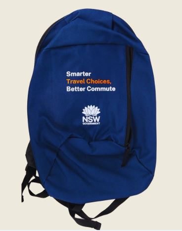 Blue backpack with Smarter Travel Choices, Better Commute and NSW Government logo.