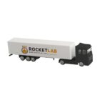 Toy truck with Rocket Lab logo on a white trailer.