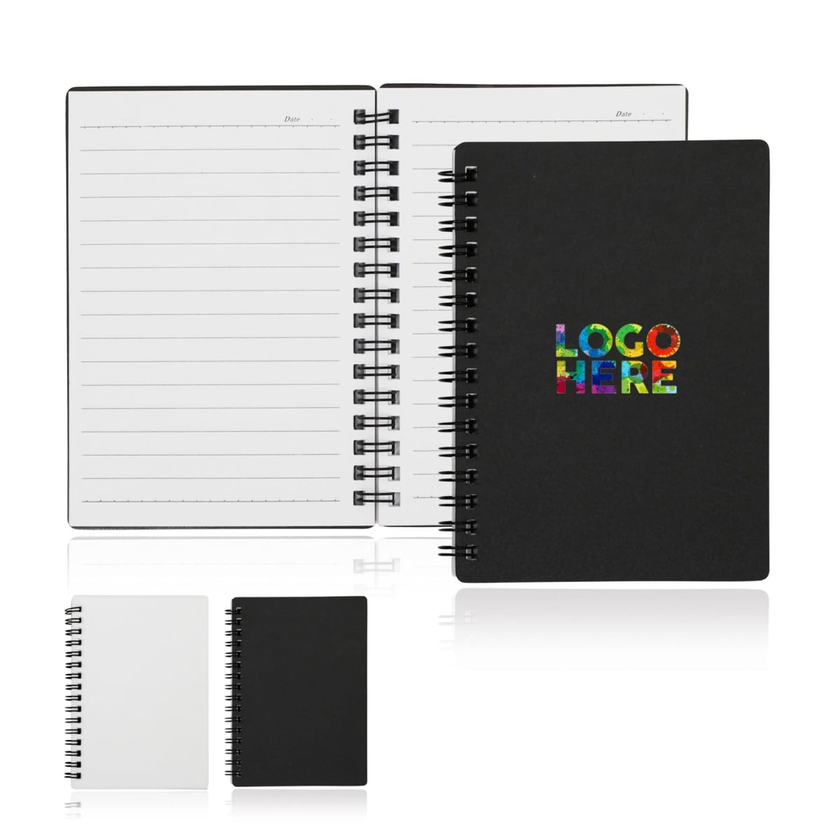 Open black notebook with lined pages and Date header, showing spiral binding. Closed version beside it has a colorful LOGO HERE text on the cover. Additional smaller black and white closed notebooks are also displayed.