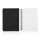 Two spiral-bound notebooks stand side by side against a plain background. The notebook on the left has a black cover, while the one on the right has a white cover. Both have a reflective surface beneath them.