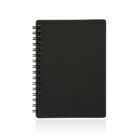 A black spiral-bound notebook is shown against a white background. The notebook is closed, and its cover is plain without any visible text or design.
